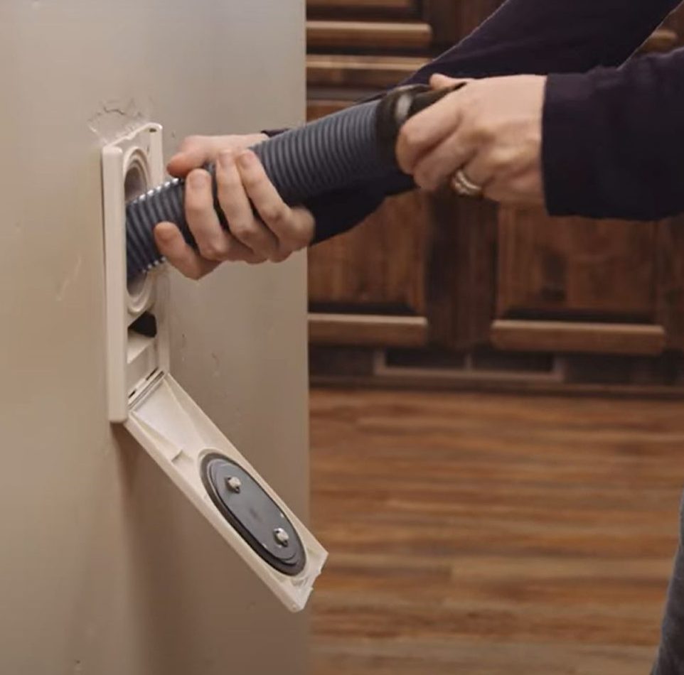 premier central vac video still retro of the Hide a Hose system