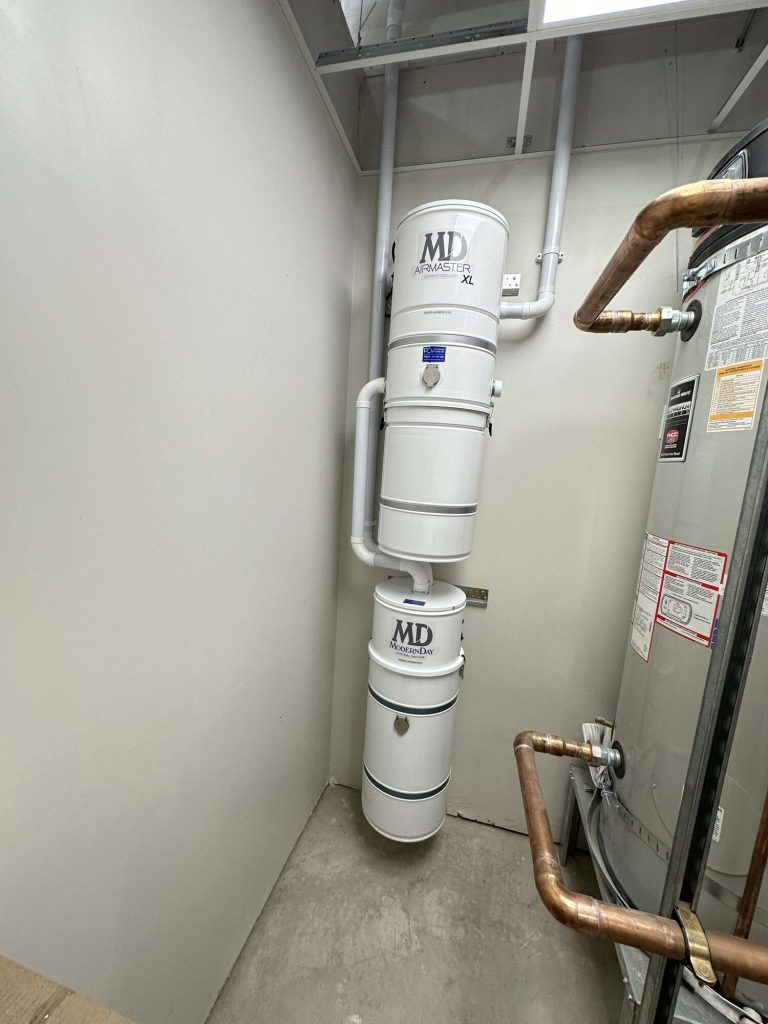 MD AirMaster XL and ModernDay central vacuum power units installed in a commercial utility room.